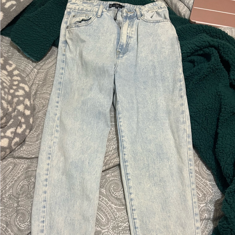 Light wash jeans. No holes